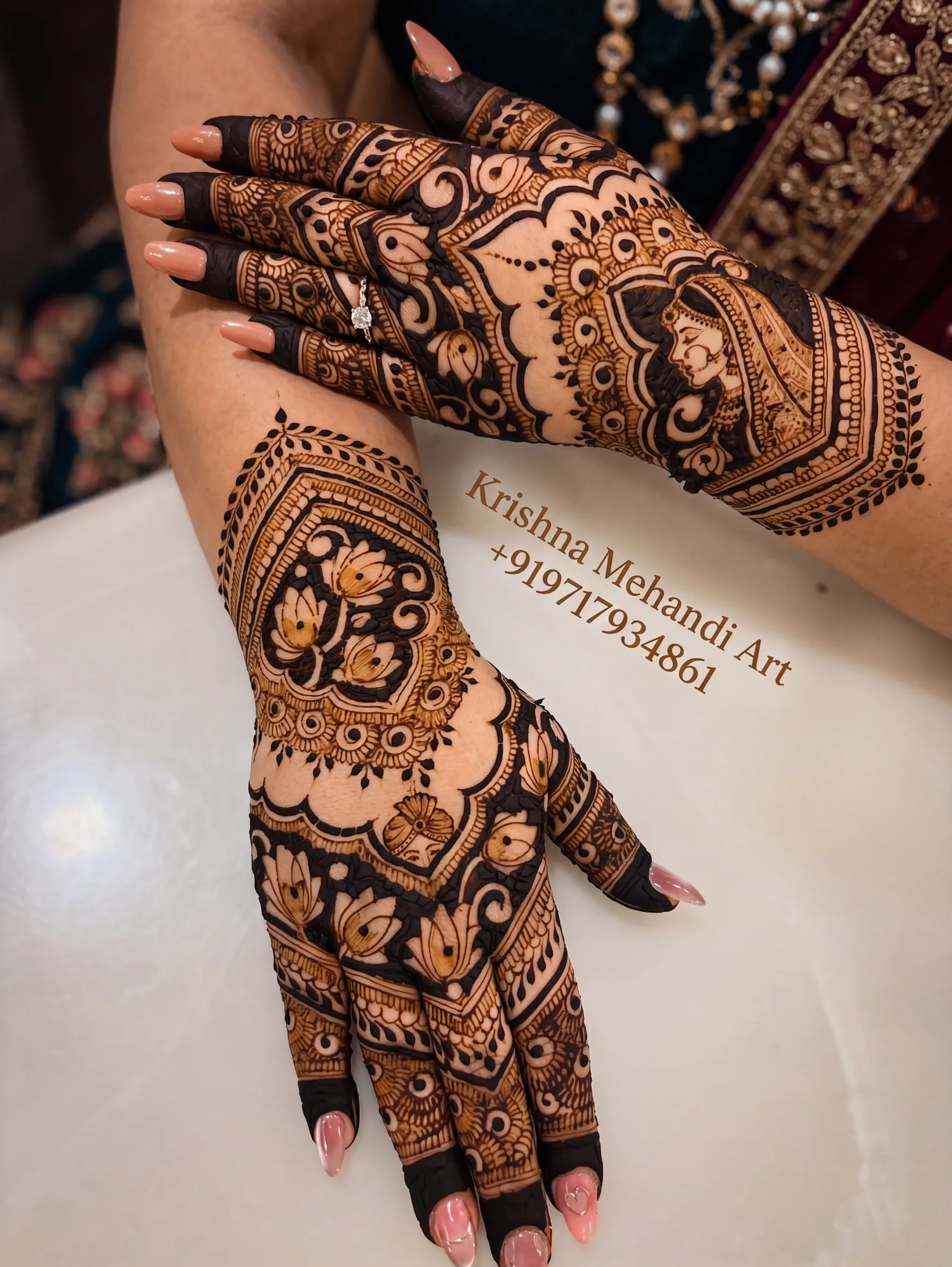 Beautiful back-hand bridal mehndi design featuring a detailed bride portrait and bold lotus motifs, created by top Chandigarh henna designer Krishna Mehandi Art.